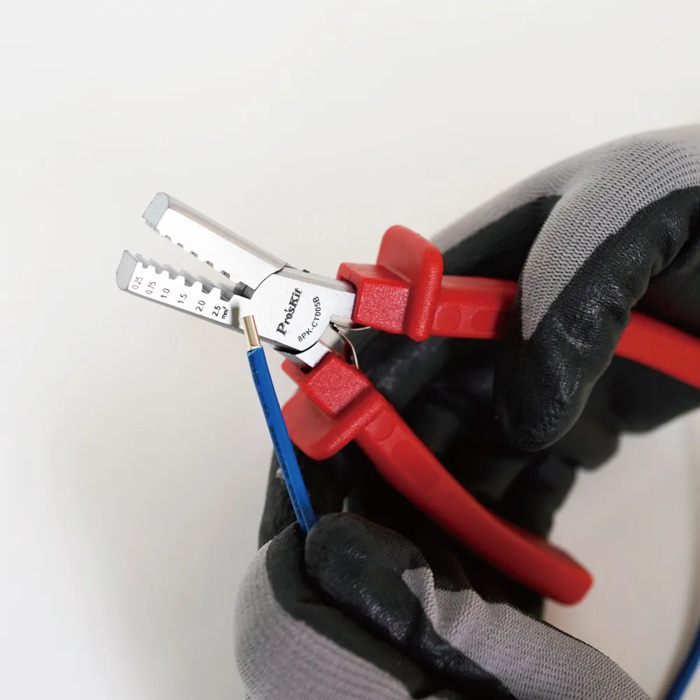 Red-handled ferrule crimping pliers crimping a ferrule onto a blue wire