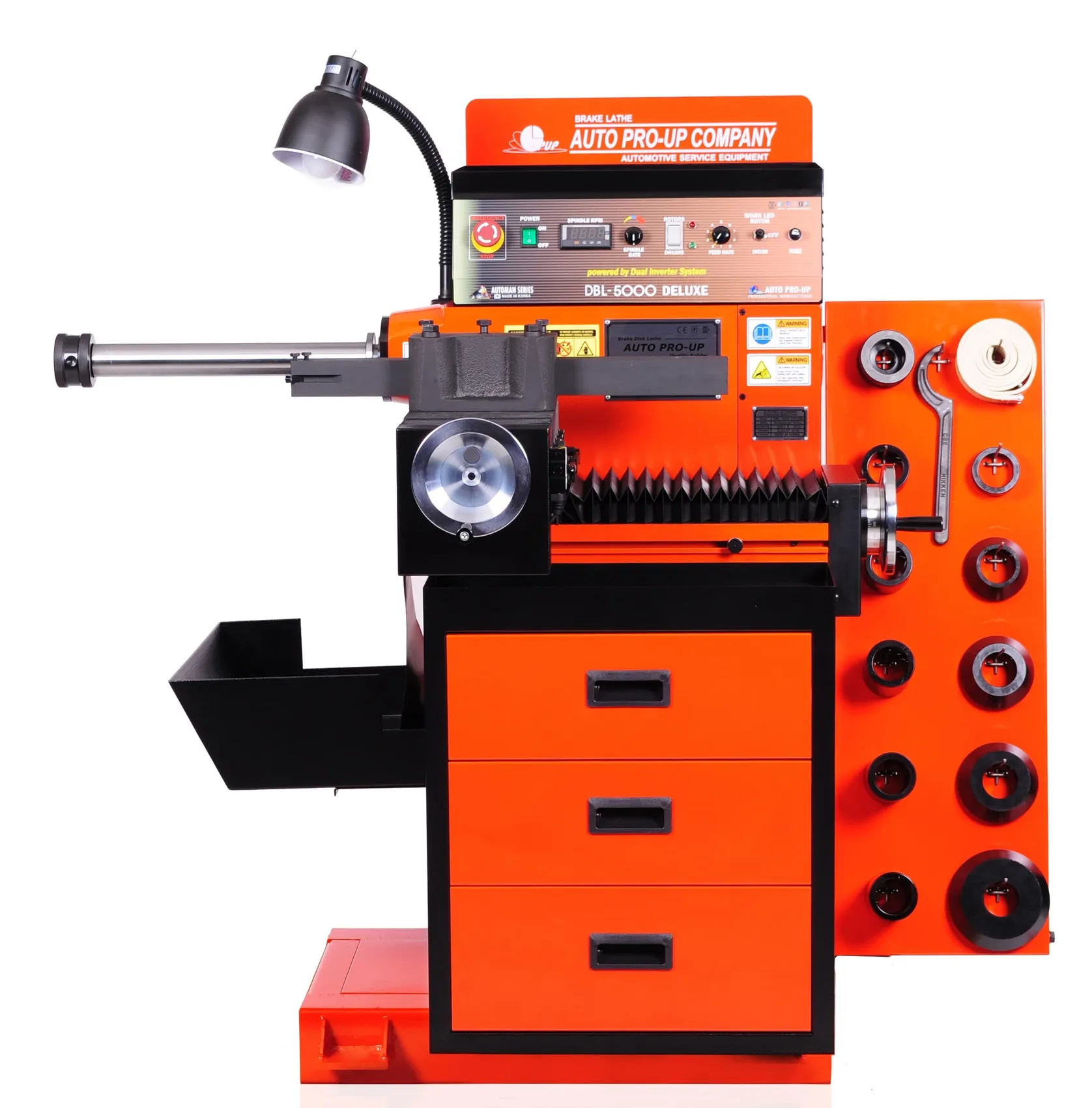 Orange heavy-duty brake lathe with drawers and a work lamp