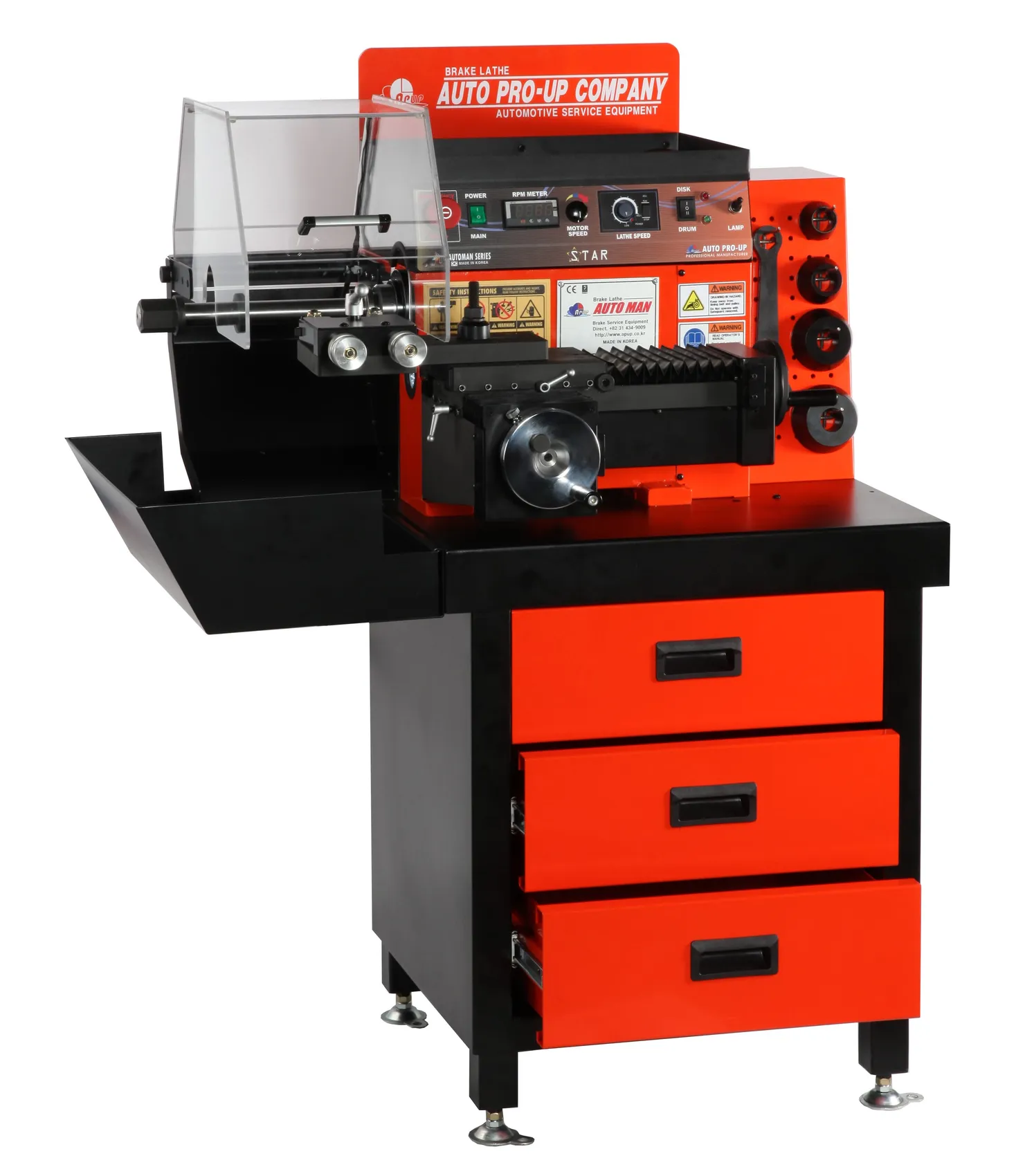Orange and black bench brake lathe on a drawer cabinet