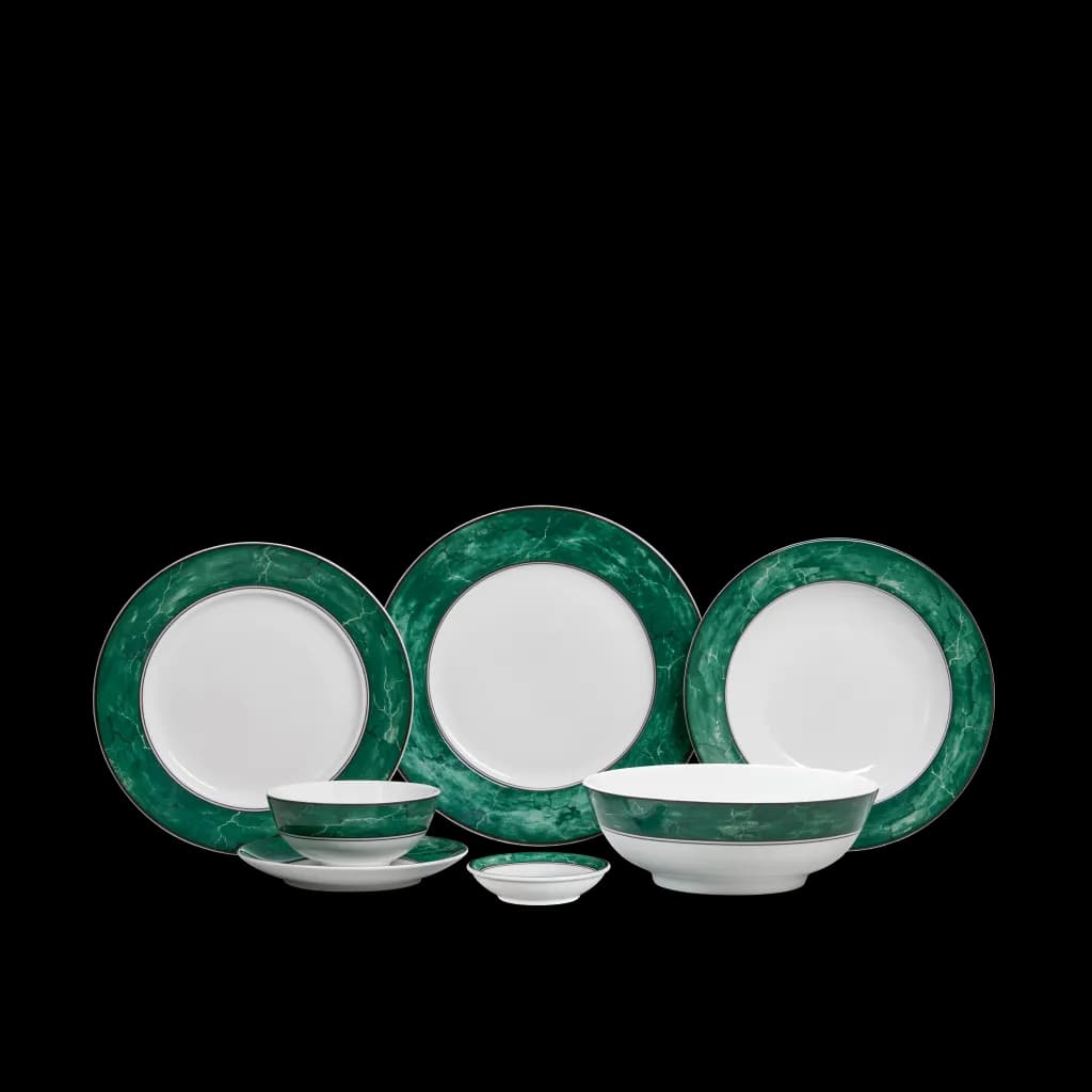 Green-rimmed porcelain plates and bowls from the Jasmine Thach Van set