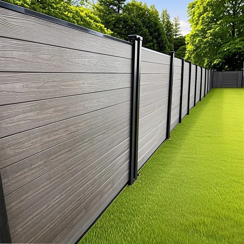 Gray fence panels on aluminum posts along a lawn