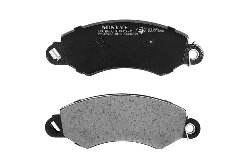 Two curved disc brake pads, one showing the friction face