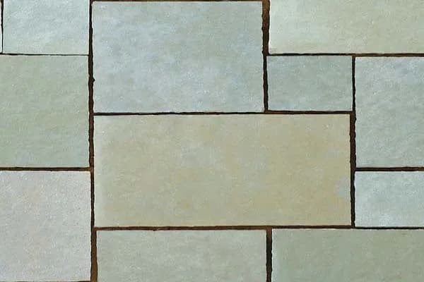 Green-gray flagstone paving laid in a random pattern