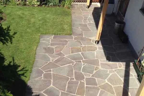 Crazy paving laid beside a lawn