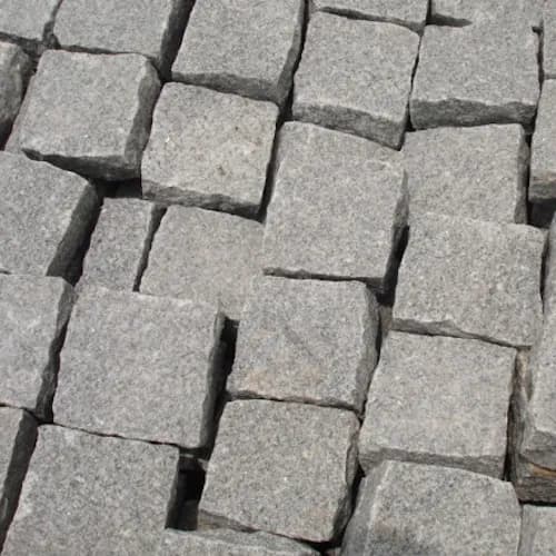 Gray granite cobblestones laid in rows