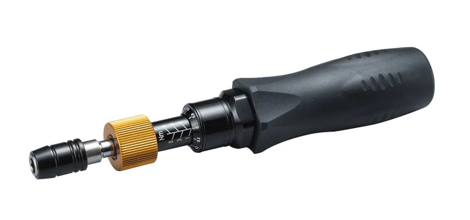 Black torque screwdriver with a gold adjustment knob