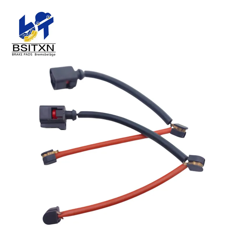 Two wear sensor leads with black connectors and orange cables