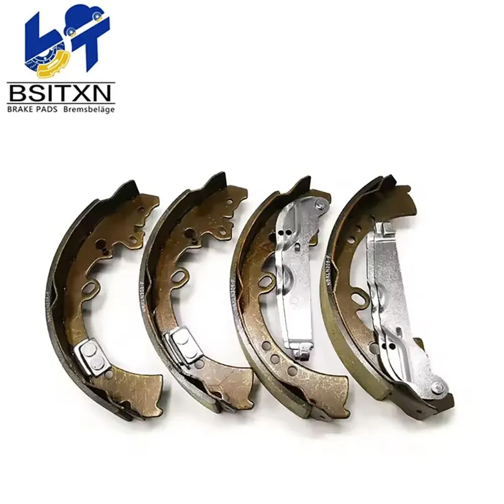 Four drum brake shoes lined up