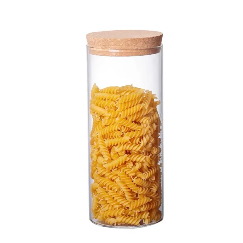 Glass storage jar with a cork lid holding pasta
