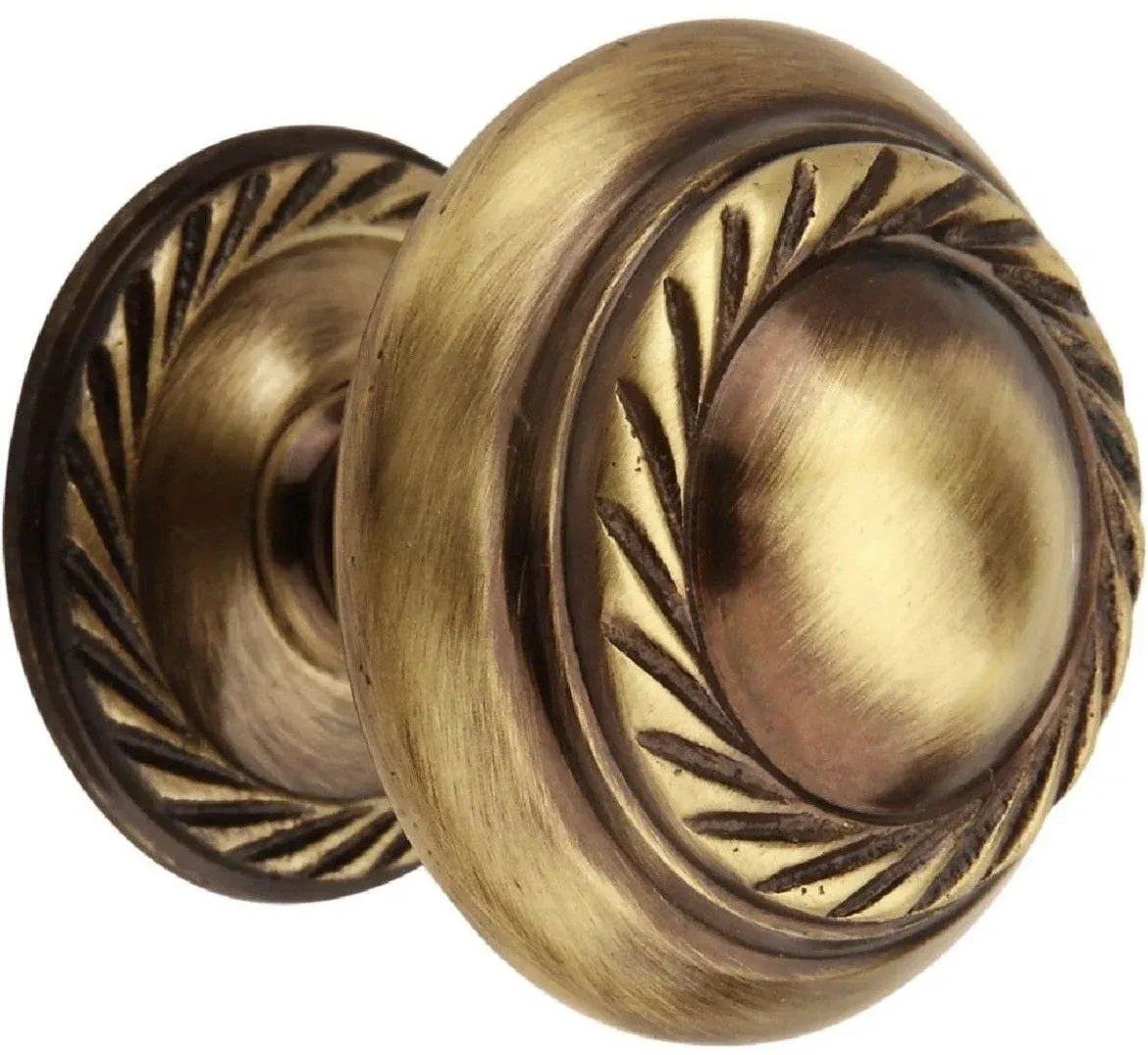 Round antique brass cabinet knob with carved rope border