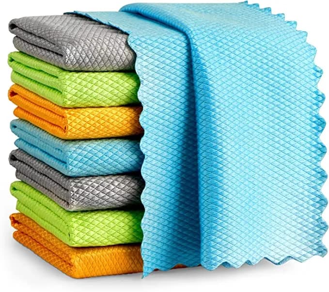 Stack of folded fish-scale cleaning cloths in several colors