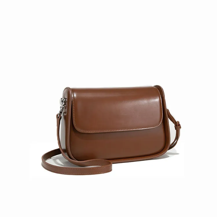 Brown PU crossbody bag with a flap and long strap