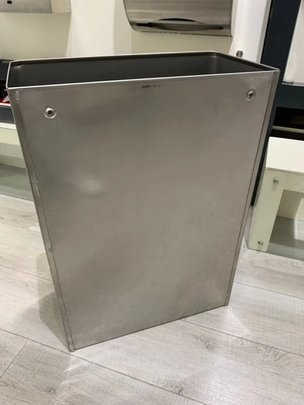 Satin stainless steel wall-mounted waste bin, angled view