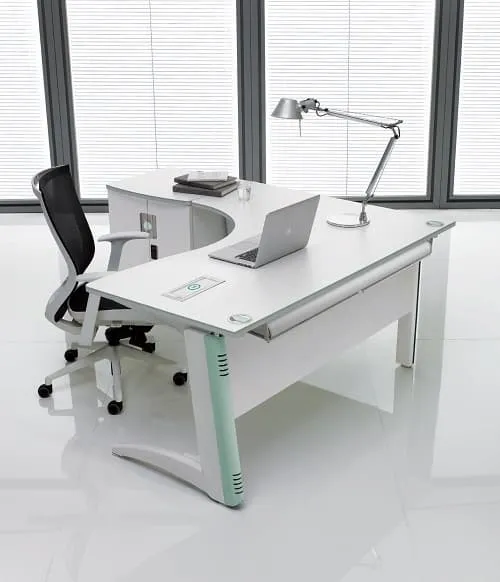 White L-shaped office desk with a mint leg cover and a black mesh chair